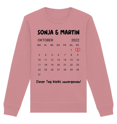 Ein weiches rosa sweatshirt mit langarm und schwarzem oktober 2022 kalender plus sonja und martin text
