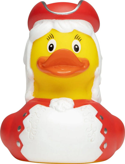 Eine gelbe quietscheente als funkenmariechen in rot mit weihnachtsmütze und weißem pelzkragen