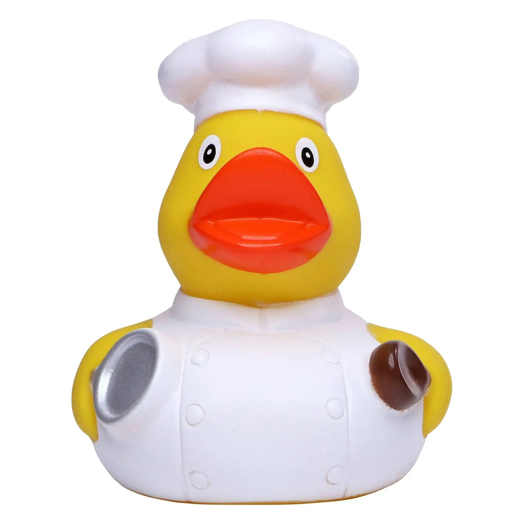 Gelbe badeente mit weißer kochmütze und schürze mit silbernen und braunen akzenten für die badewanne