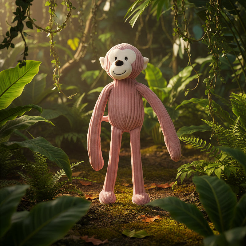 Ein weicher rosa corduroy affe plüschtier mit weißem gesicht und lächelndem ausdruck von minifeet lanky legends