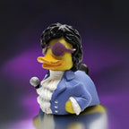 Eine gelbe gummiente als glamouröse sängerin mit schwarzer lockiger haarpracht und violetten sonnenbrillen im produkt paddle like its 1999 von celebri ducks