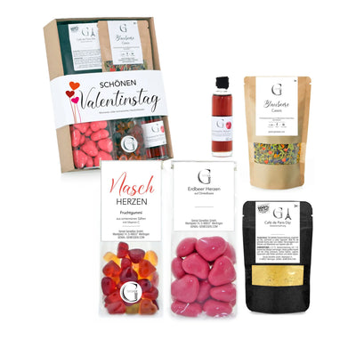 Ständiger valentinstag geschenkset präsentkorb mit herzförmigen süßigkeiten, beeren sirupflasche und tee paketierung