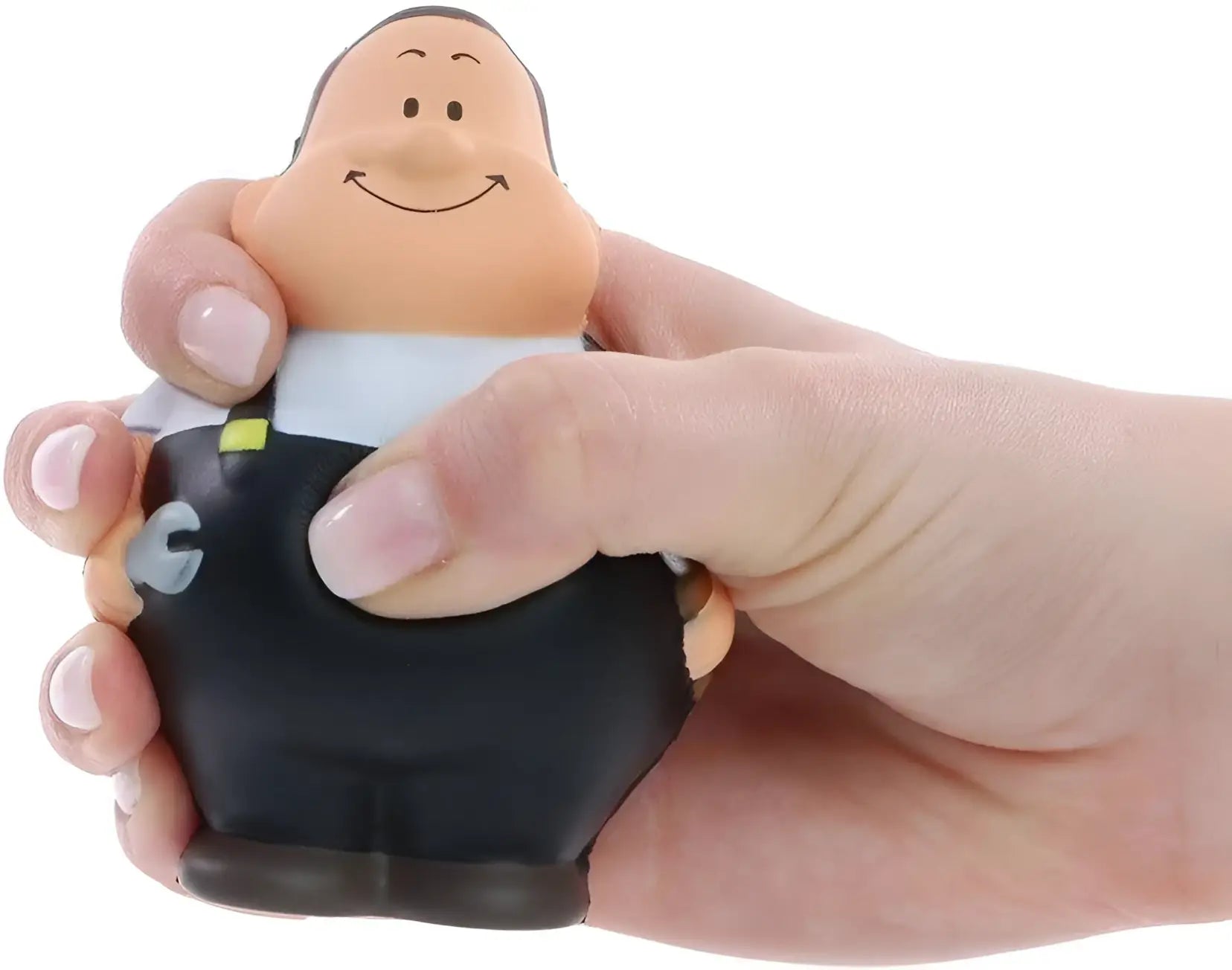 Ein lächelnder, pummeliger stressball in beige mit schwarzem anzug von schrauber bert anti-stress-quetsch-figur