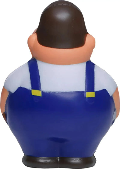 Blaue overall mit gelben trägern an schrauber bert anti stress quietschfigur mit braunen haaren und pfirsichfarbener haut