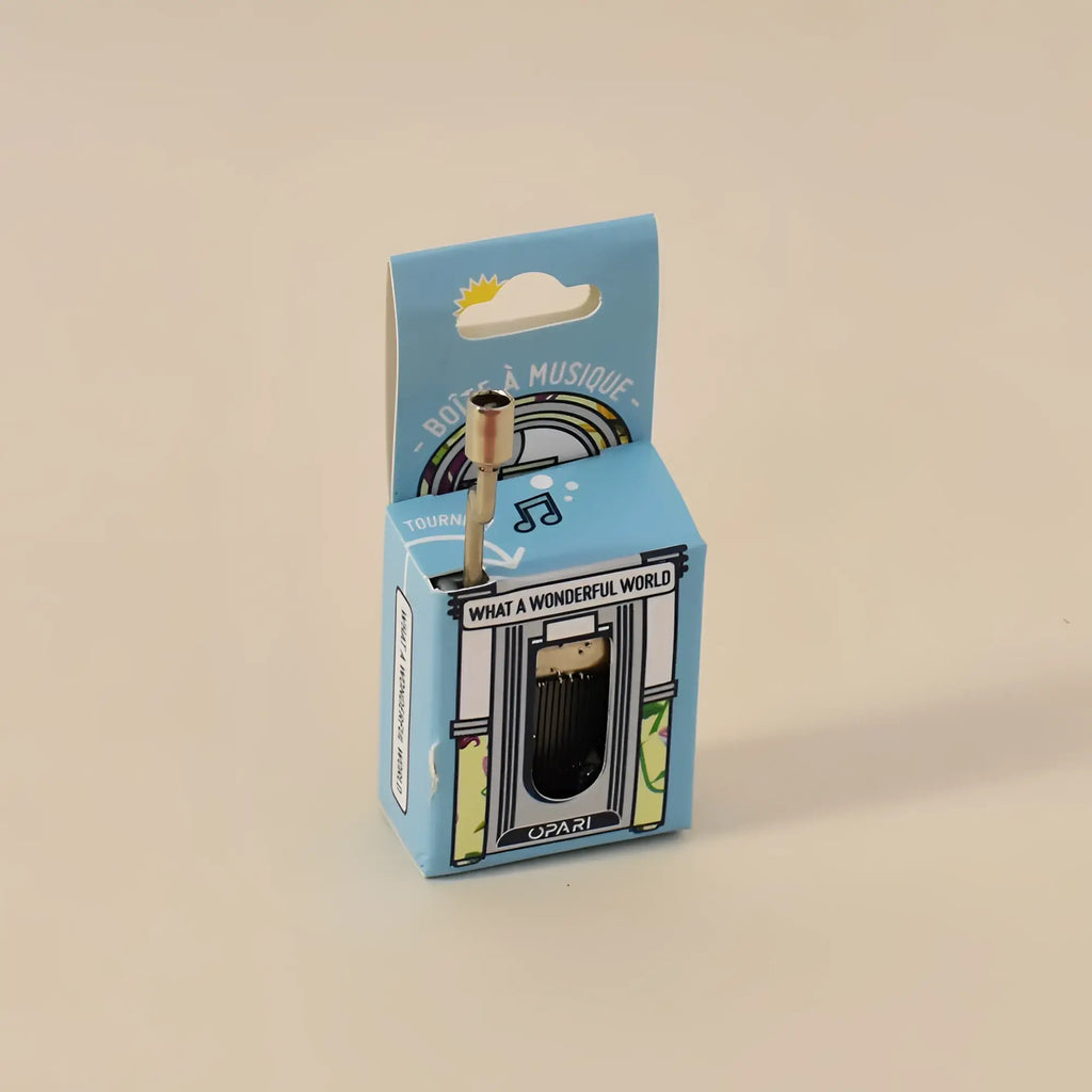 miniature brass spieluhr music box mit goldfarben top und schwarz Innenseite in Hellblau box mit musical notes und what wonderful world Text