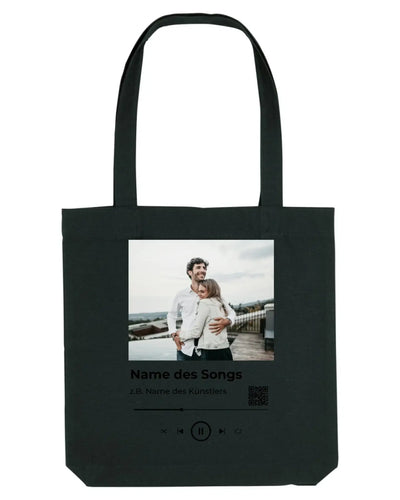 Schwarze leinwandtasche mit fotodruck zweier menschen umarmung und musikplayer text spotify fotomotiv collection