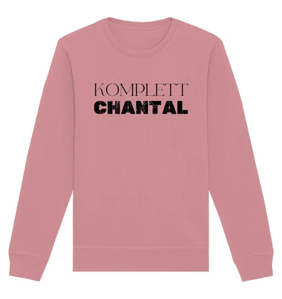 Ein softes pinkes sweatshirt mit langen ärmeln und dem text komplett chantal in fetten schwarzen buchstaben