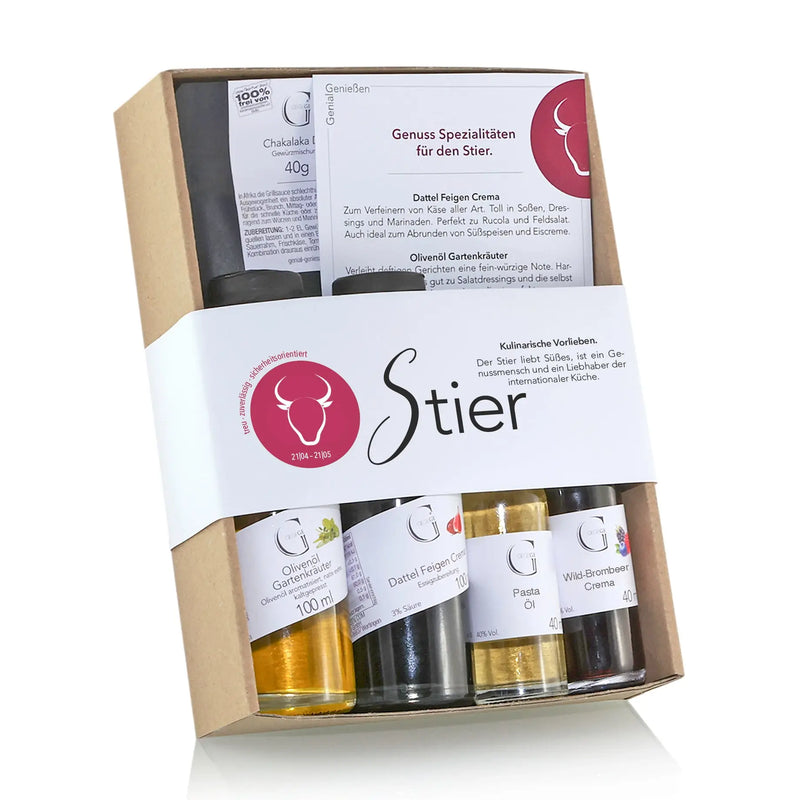 Ein sternzeichen-set von stier mit vier glasflaschen gourmet-produkten wie olivenöl dattel feigen creme und pastaöl