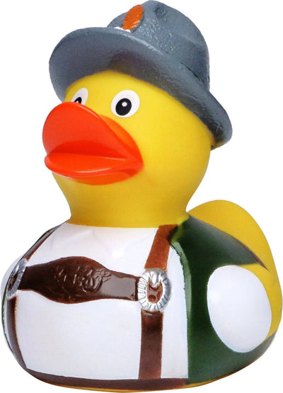 Gelbe quietscheente in tracht mit grauem hut und orange emblem in weiß grün mit braunen lederriemen und silberner schnalle