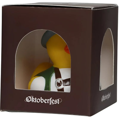 Gelbe badeente mit grüner und weißer oktoberfest-tracht und dunkler mütze mit silberner schnalle von schnabels