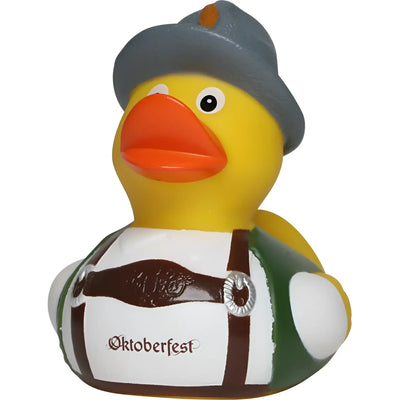 Gelbe badeente von schnabels mit grauem hut und grün-weißem oktoberfest-tracht outfit und braunem gürtel