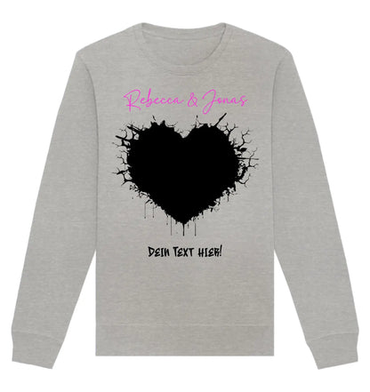 Ein heather grauer langarm sweatshirt mit schwarzem sprenkelherz und pinkem sowie schwarzem schriftzug aus der wildes herz statement-collection