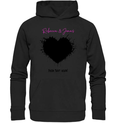 Schwarzer hoodie aus wildes herz statement collection mit großem schwarzem herz und pinkem schriftzug