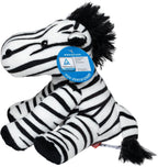 plüschtier zebra zora mit schwarz-weißen streifen aus weichem stoff und flauschiger textur